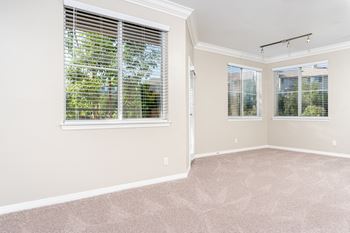 a bedroom with three windows at Missions at Chino Hills, Chino Hills, 91709